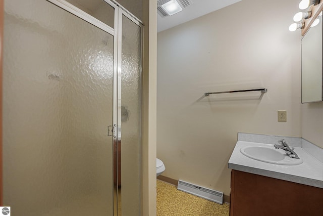 7786 N Shore Ct, Grawn, MI 49637 - full bath with vanity, a stall shower, tile patterned floors, and baseboard heating