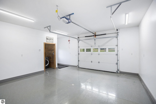 23736 110th Ave, Tustin, MI 49688 - garage with a garage door opener and baseboards