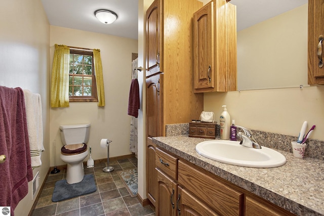 1520 Kuehn Rd, Sterling, MI 48659 - bathroom with toilet and vanity