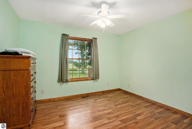 1520 Kuehn Rd, Sterling, MI 48659 - unfurnished room featuring light wood finished floors and a ceiling fan