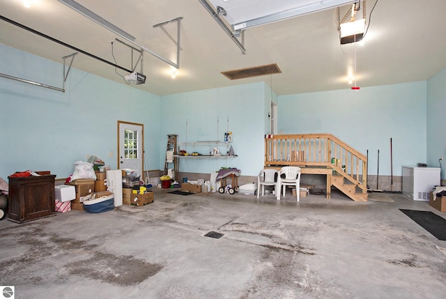 1520 Kuehn Rd, Sterling, MI 48659 - garage with a garage door opener