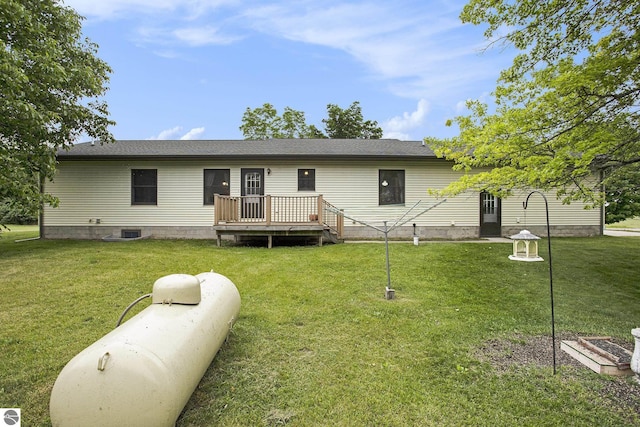 1520 Kuehn Rd, Sterling, MI 48659 - rear view of house with a deck, a yard, and roof with shingles