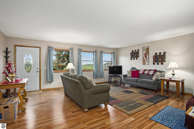 1520 Kuehn Rd, Sterling, MI 48659 - living room featuring healthy amount of natural light and wood finished floors