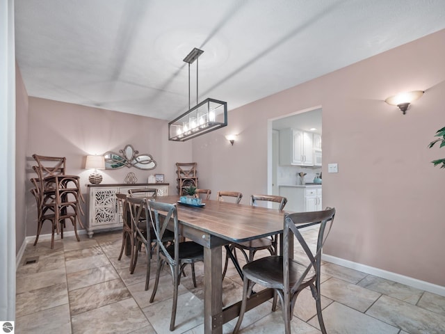 398 High View Rd, Traverse City, MI 49696 - dining room featuring baseboards