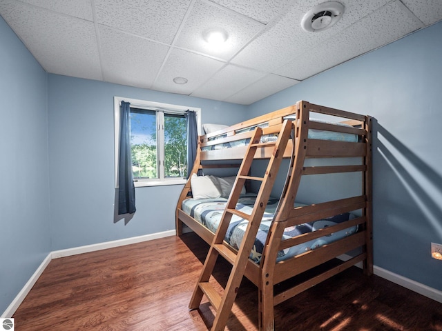 398 High View Rd, Traverse City, MI 49696 - bedroom featuring a paneled ceiling and wood finished floors