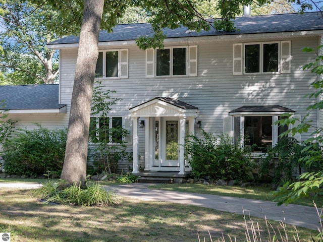 398 High View Rd, Traverse City, MI 49696 - colonial house with a shingled roof