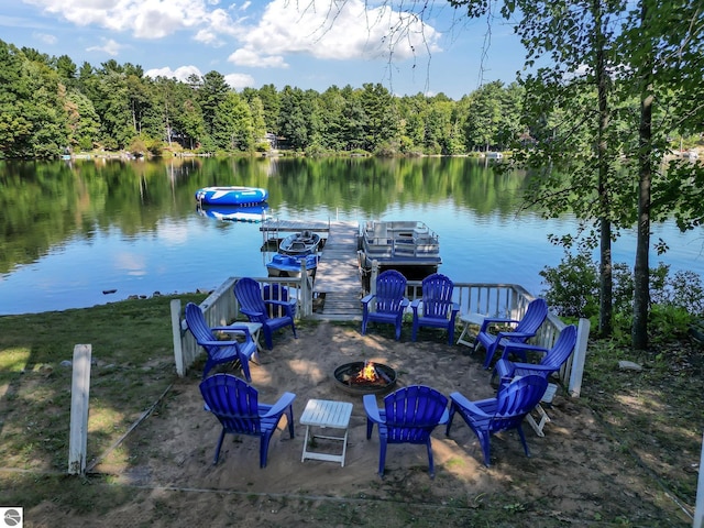 398 High View Rd, Traverse City, MI 49696 - dock with a fire pit, a water view, and a forest view
