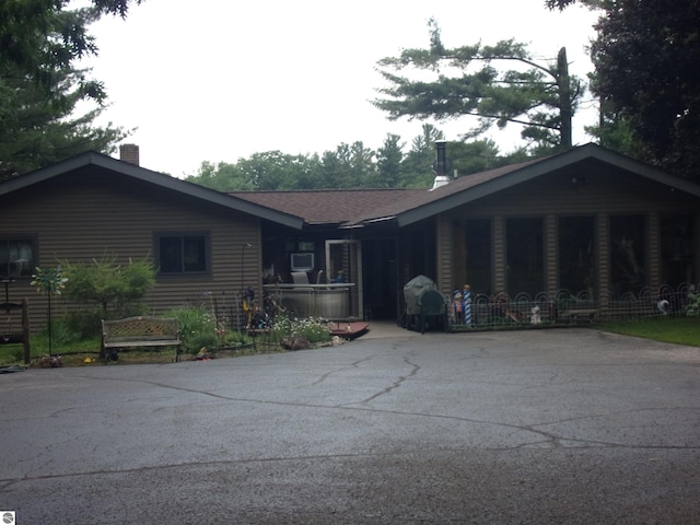 60 Sheer Rd, East Tawas, MI 48730 - single story home featuring a chimney