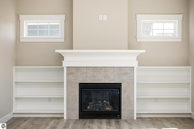 1572 Oban Way, Traverse City, MI 49696 - detailed view of wood finished floors and a tiled fireplace