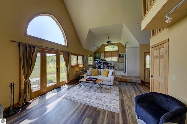10702 E Hill Top Rd, Suttons Bay, MI 49682 - living room with high vaulted ceiling, wood finished floors, and a ceiling fan