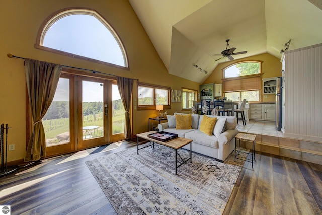 10702 E Hill Top Rd, Suttons Bay, MI 49682 - living area featuring vaulted ceiling, a ceiling fan, light wood-style floors, and french doors