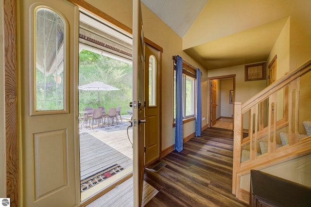 10702 E Hill Top Rd, Suttons Bay, MI 49682 - foyer featuring dark wood finished floors, lofted ceiling, and stairway