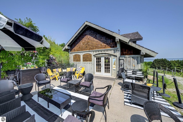 10702 E Hill Top Rd, Suttons Bay, MI 49682 - view of patio / terrace featuring french doors and an outdoor living space