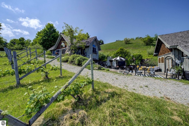 10702 E Hill Top Rd, Suttons Bay, MI 49682 - view of yard with a patio