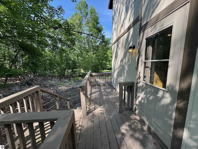 6740 Pheasant Run, Gaylord, MI 49735 - deck featuring view of wooded area