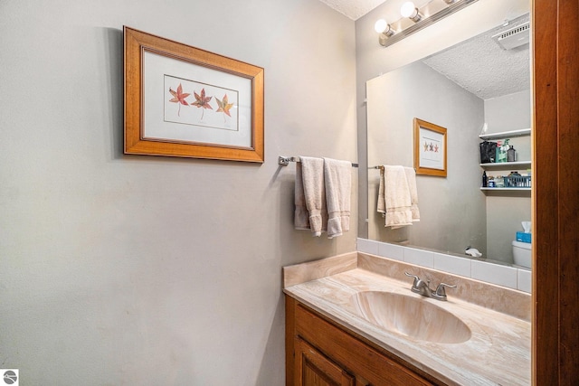 6740 Pheasant Run, Gaylord, MI 49735 - bathroom featuring vanity and a textured ceiling