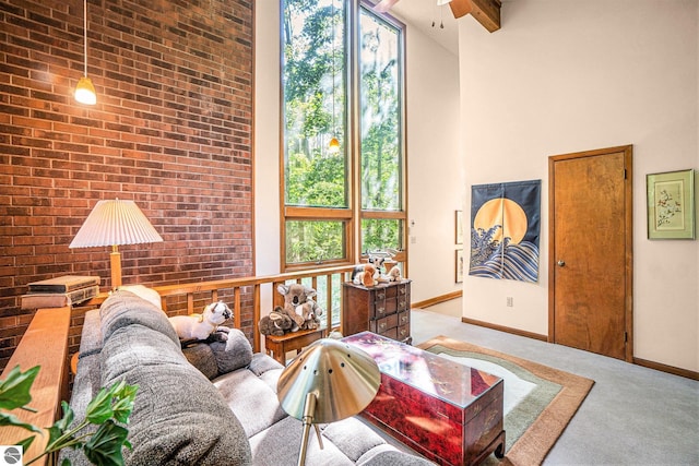 6740 Pheasant Run, Gaylord, MI 49735 - living room with a high ceiling, carpet, and a ceiling fan