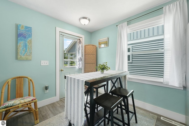 1029 E Front St, Traverse City, MI 49686 - dining space with baseboards and wood finished floors