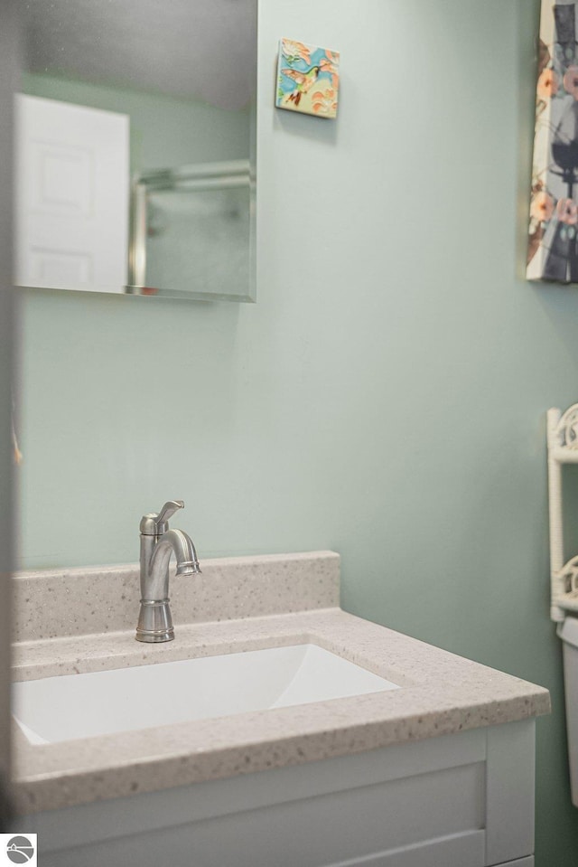 1029 E Front St, Traverse City, MI 49686 - bathroom featuring vanity and toilet