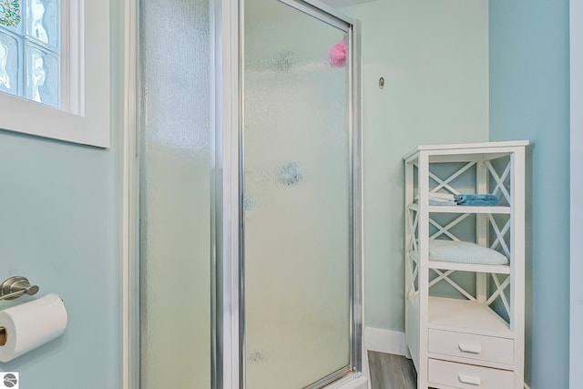 1029 E Front St, Traverse City, MI 49686 - full bathroom featuring a stall shower and baseboards