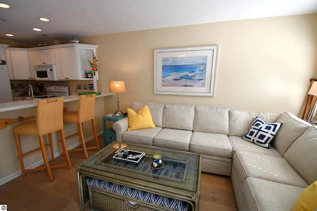 13354 Stover Rd Unit 6, Charlevoix, MI 49720 - living room with recessed lighting and light wood-style floors