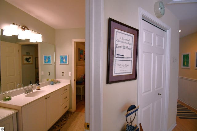 13354 Stover Rd Unit 6, Charlevoix, MI 49720 - bathroom with vanity and wood finished floors