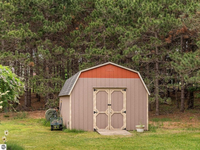 10355 Fencepost Ln, Traverse City, MI 49685 - view of shed with a view of trees
