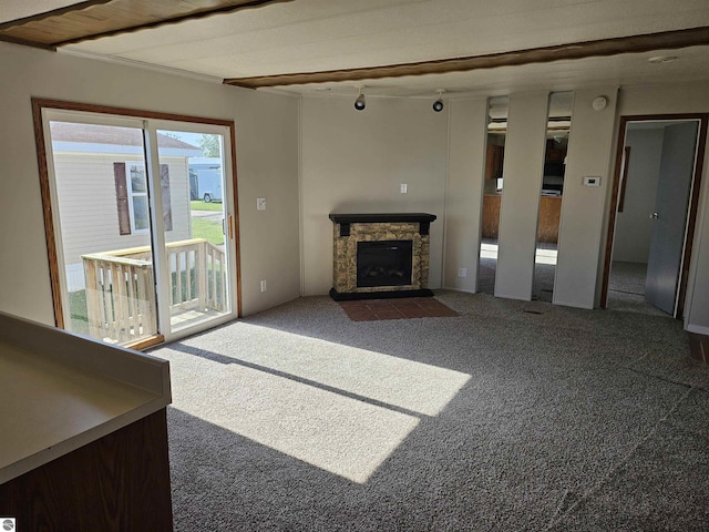 4151 E Jordan Rd Lot 51, Mount Pleasant, MI 48858 - unfurnished living room with carpet flooring, a fireplace, and track lighting