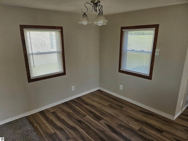 4151 E Jordan Rd Lot 51, Mount Pleasant, MI 48858 - spare room with dark wood-type flooring and baseboards