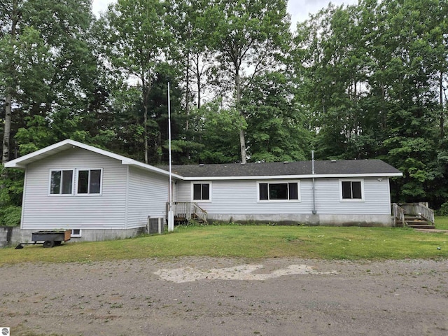 3962 Power Dr, Mikado, MI 48745 - manufactured / mobile home featuring view of wooded area and a front lawn