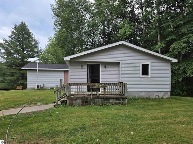 3962 Power Dr, Mikado, MI 48745 - view of front facade with a front lawn and a wooden deck