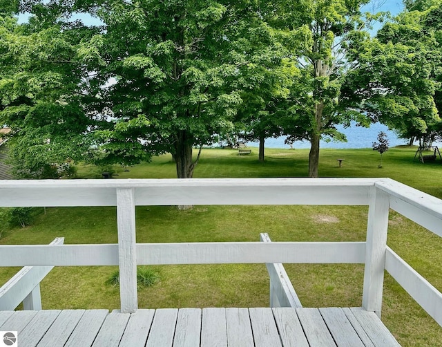 3775 W Cedar Lake Rd, Greenbush, MI 48738 - wooden deck with a yard and a water view