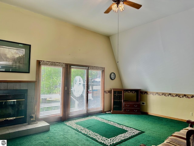 3775 W Cedar Lake Rd, Greenbush, MI 48738 - carpeted living area with ceiling fan, a tile fireplace, and high vaulted ceiling