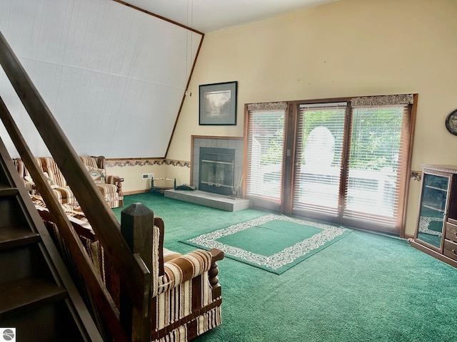 3775 W Cedar Lake Rd, Greenbush, MI 48738 - living room with carpet floors, vaulted ceiling, stairs, and a fireplace