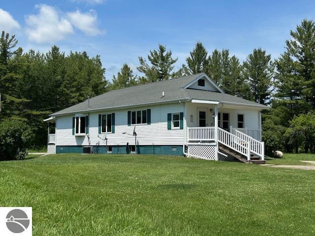2393 Oates Rd, Tawas City, MI 48763 - view of front of home featuring a front yard and covered porch