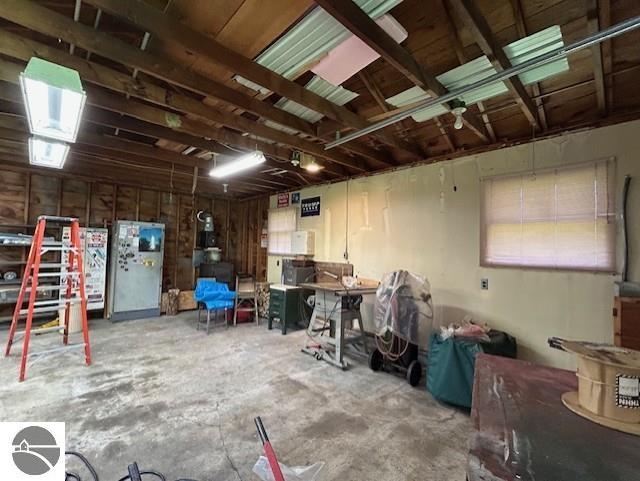 2393 Oates Rd, Tawas City, MI 48763 - misc room with a garage and concrete floors