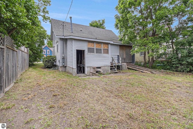 718 Forest Ave, Frankfort, MI 49635 - rear view of house with roof with shingles