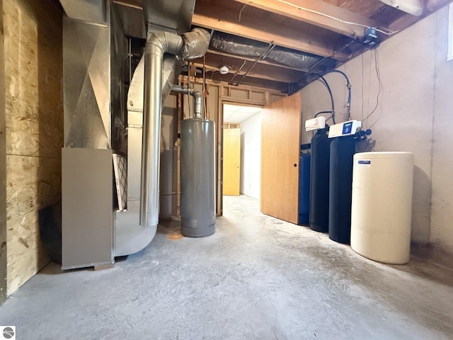 2082 Dusty Trl, Kingsley, MI 49649 - unfinished below grade area with water heater, heating unit, and a water softener