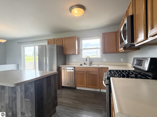 2082 Dusty Trl, Kingsley, MI 49649 - kitchen with stainless steel appliances, healthy amount of natural light, dark wood finished floors, and light countertops