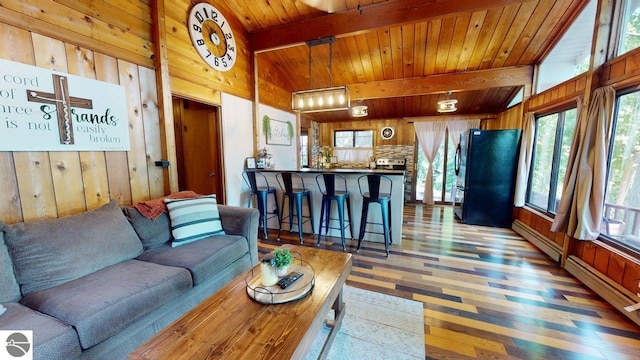 7851 White Birch Dr, Farwell, MI 48622 - living area with wood walls, wood finished floors, and wooden ceiling