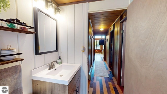 7851 White Birch Dr, Farwell, MI 48622 - bathroom with vanity and wood finished floors