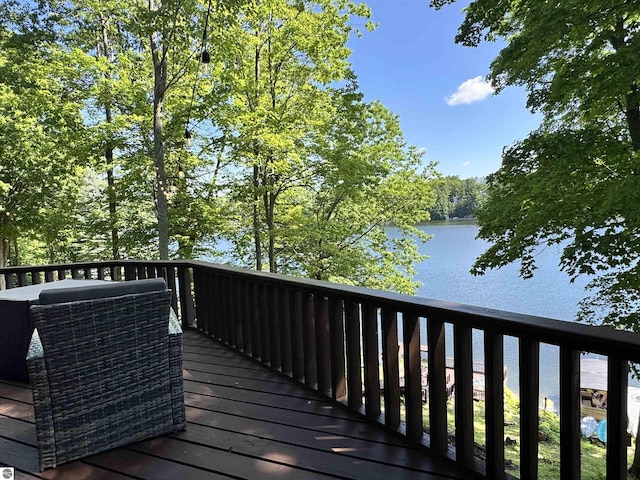 7851 White Birch Dr, Farwell, MI 48622 - wooden deck featuring a water view