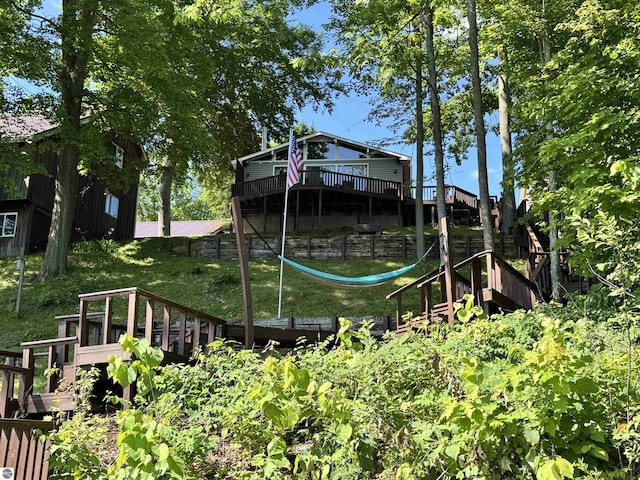 7851 White Birch Dr, Farwell, MI 48622 - rear view of property with a deck and a yard