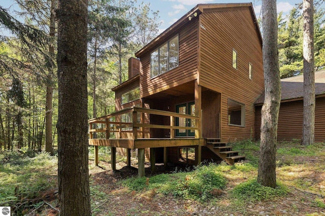 12271 E Woolsey Lake Rd, Northport, MI 49670 - back of property with a wooden deck and stairway