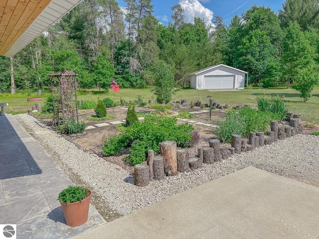 5670 N Harrison Ave, Harrison, MI 48625 - view of grassy yard featuring a detached garage and an outdoor structure