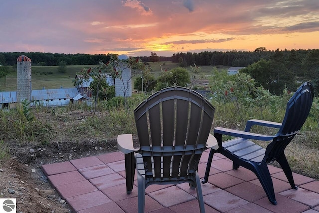 13333 S Coleman Rd, Empire, MI 49630 - patio terrace at dusk with a patio area