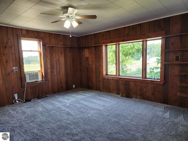 13333 S Coleman Rd, Empire, MI 49630 - carpeted empty room with a ceiling fan, cooling unit, and wooden walls