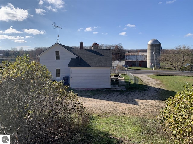 13333 S Coleman Rd, Empire, MI 49630 - view of side of property with a chimney