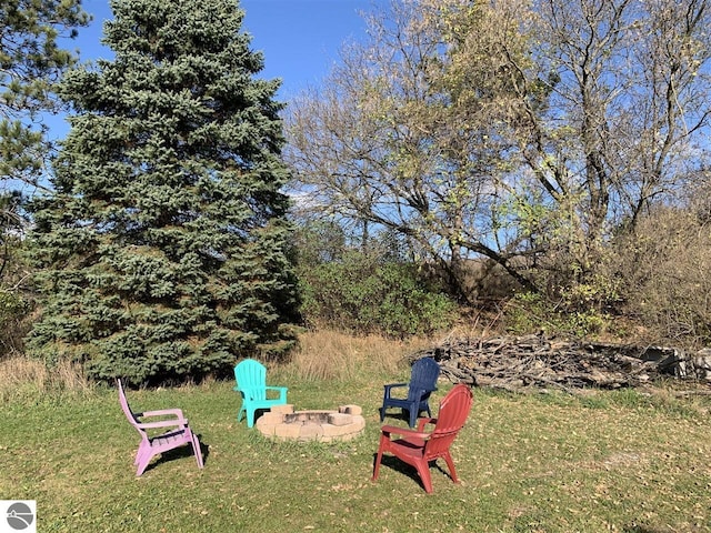 13333 S Coleman Rd, Empire, MI 49630 - view of green lawn featuring an outdoor fire pit