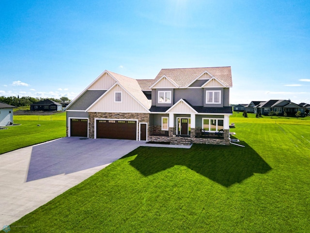 craftsman-style house featuring a garage and a front yard